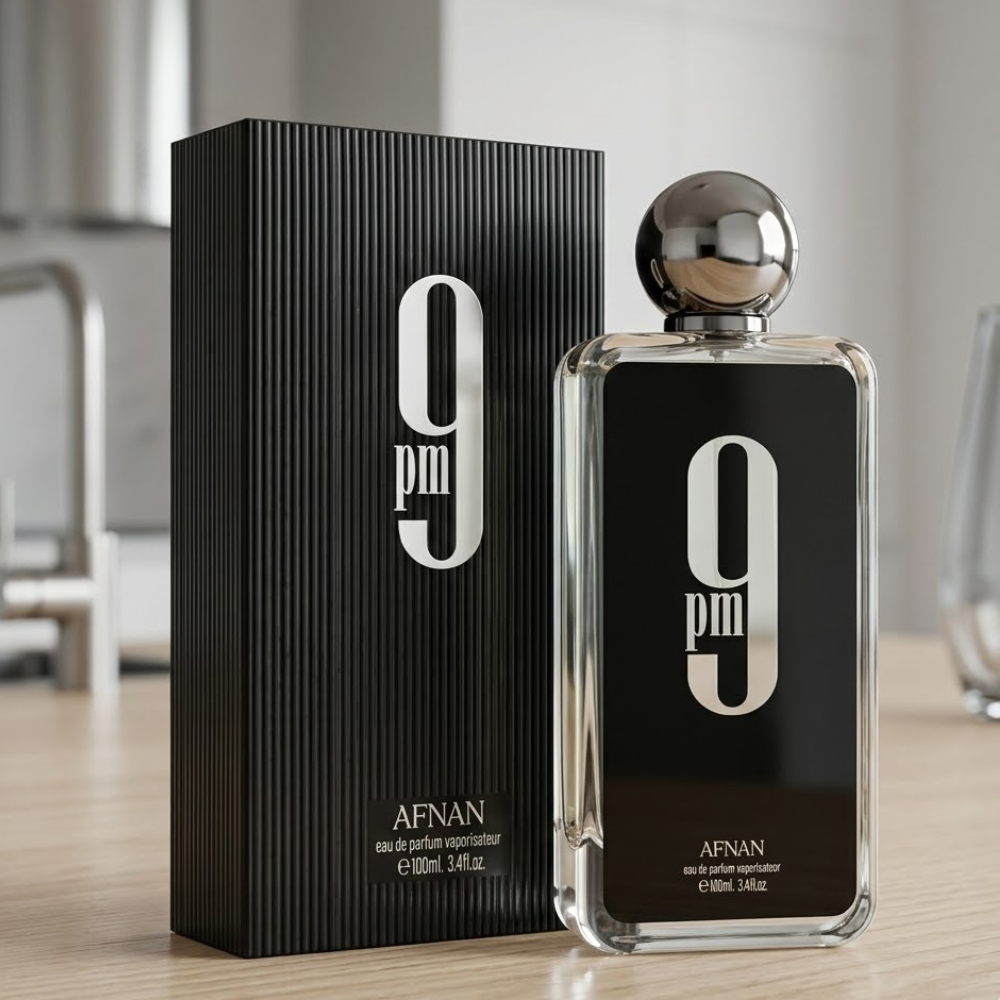 Perfume Afnan 9 PM frasco negro con tapa metálica y caja elegante sobre mesa