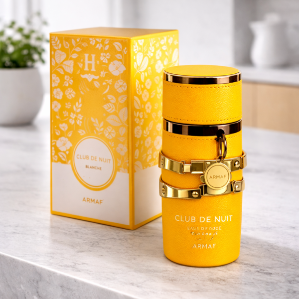 Frasco de perfume Yara Tous de Lattafa color amarillo vibrante con detalles dorados elegantes.